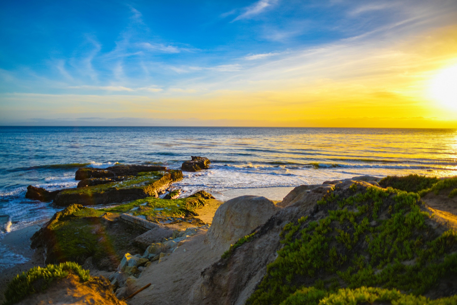 Golden hour along a rocky stretch of Hope Ranch coastline